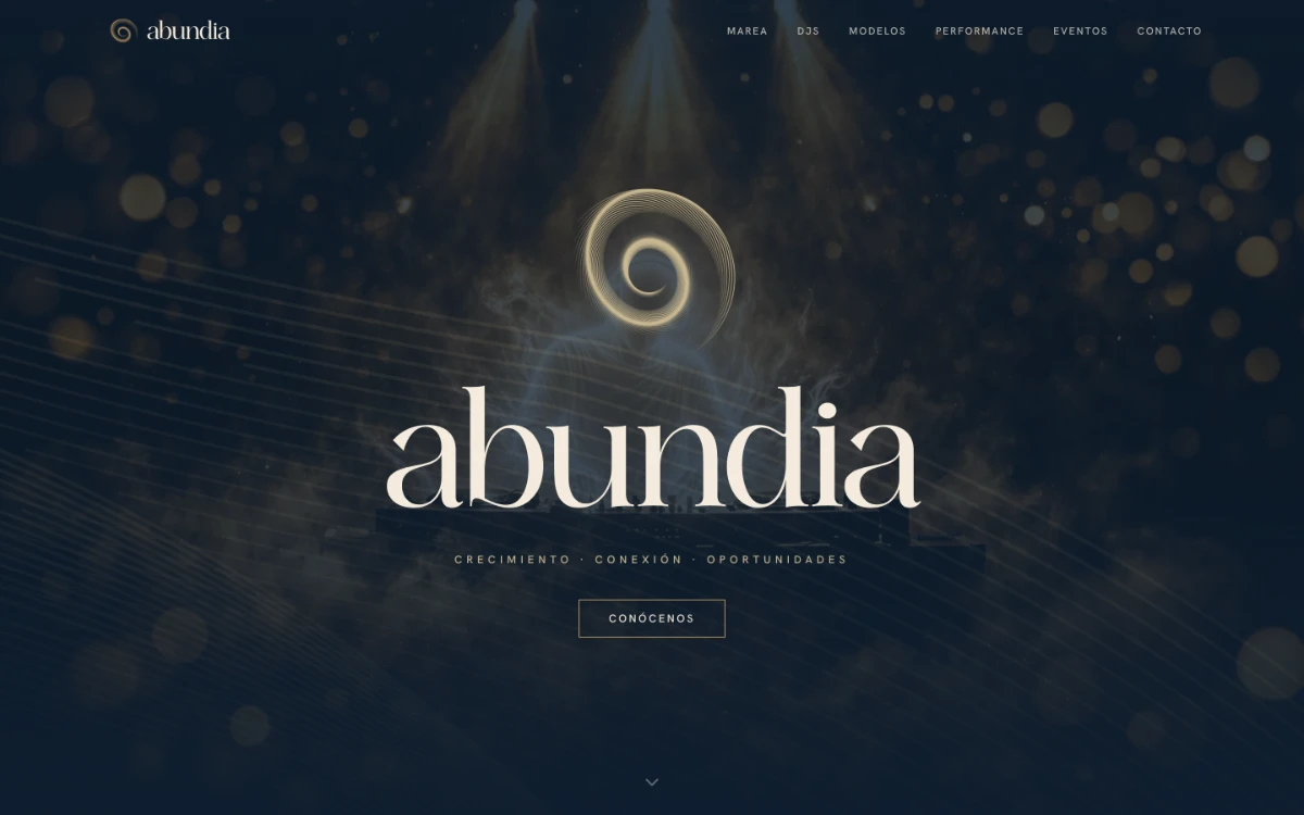 Sitio de Abundia Agency: hero índigo con isotipo espiral dorado y la palabra ‘abundia’ en serif Ethereal